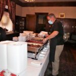 Freddie Faraone, Farone Catering with ready to go meals in the dining room