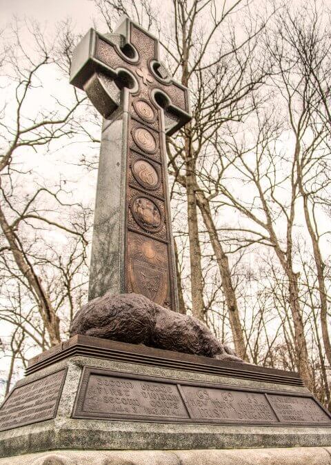 The Irish Brigade monument at Gettysburg of a Celtic cross, shadowing the Irish Wolfhound