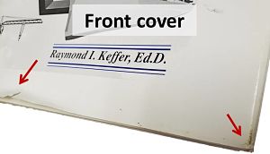 small tear in bottom of front cover