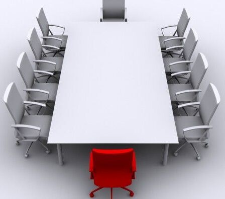 photo of board room table and chairs