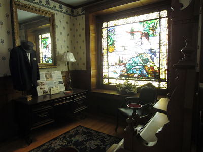 photo of upper hall with 7 foort stained glass window