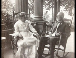 photo of ET and Ella Frampton Kurtz sitting on porch of their house