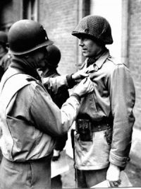 wwii soldier receiving medal from officer