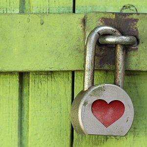 large padlock on wooden door