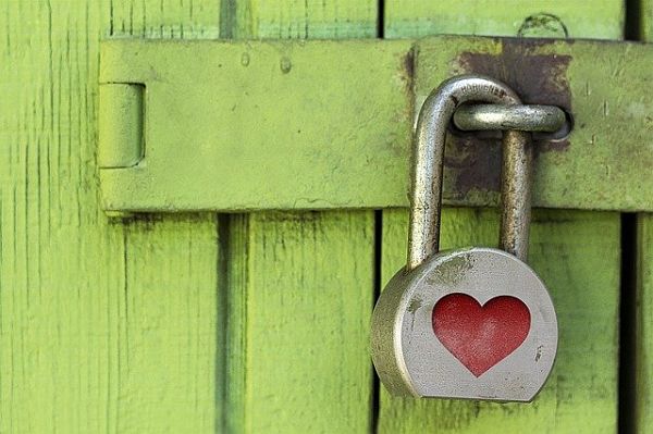 large padlock on wooden door