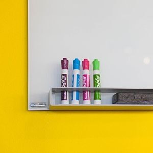 white board with colored markers and eraser